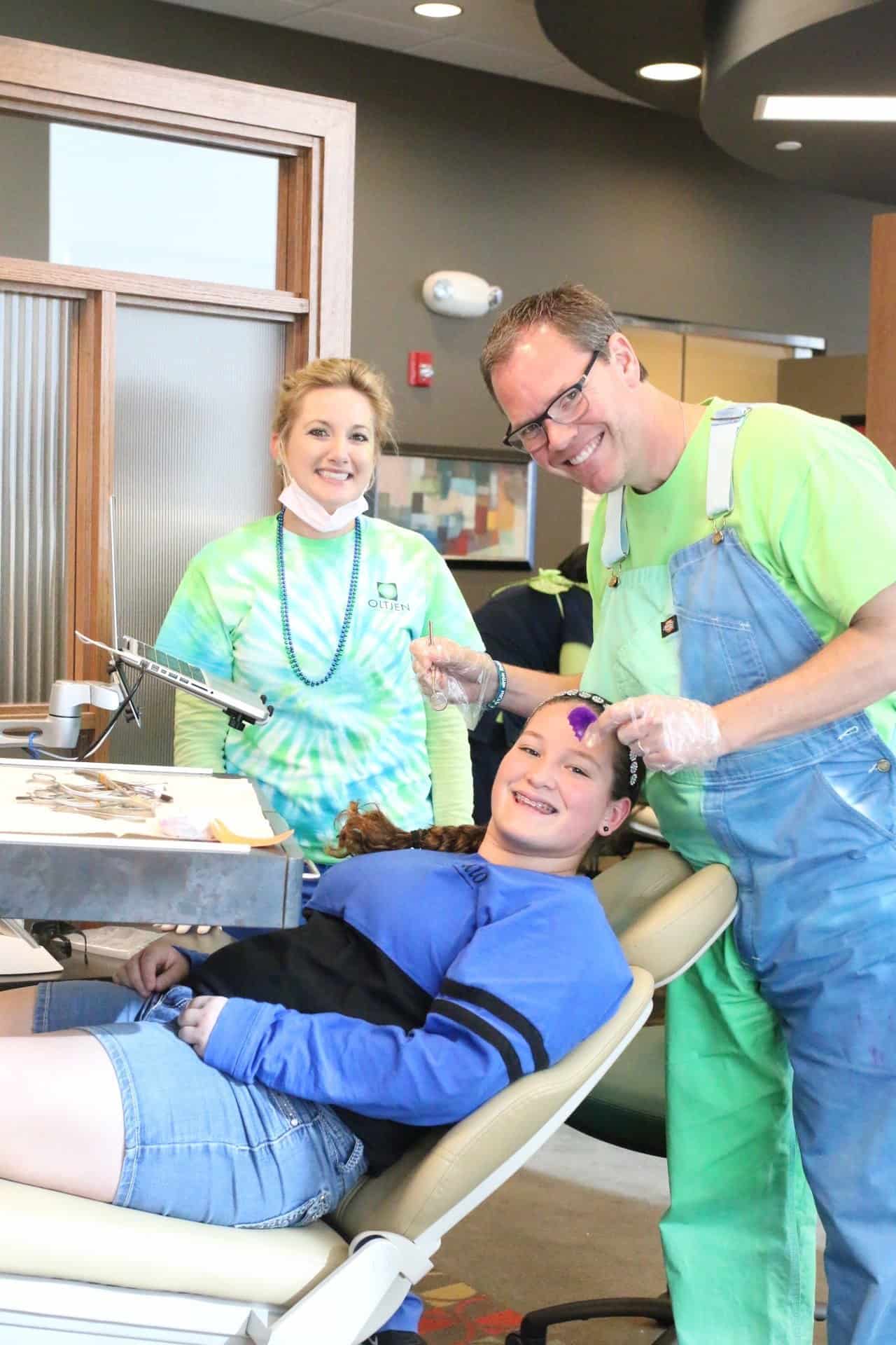 patient-with-Dr.-Lauren-blue-green-1-e1524244552107  - Braces and Invisalign in Kansas City, Overland Park, Olathe, and Paola, Kansas - Oltjen Orthodontics